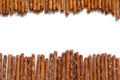 Salted pretzel sticks on white background