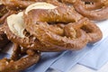 Salted pretzels on blue and white napkin