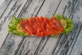 Salted red fish with lemon and greens Royalty Free Stock Photo