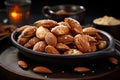 Salted roasted almonds in a small black bowl on a bar table