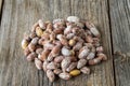 Salted peanuts on wood floor. bulk peanut kernels Royalty Free Stock Photo