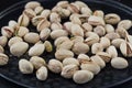 Salted roasted pistachios nuts on old iron background. Royalty Free Stock Photo