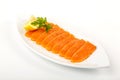 Salted salmon with butter and lemon. Plate on a white background