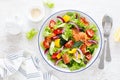 Salted salmon salad with fresh green lettuce, cucumbers, tomato, bell pepper and red onion. Ketogenic, keto or paleo diet lunch Royalty Free Stock Photo