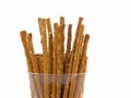 Salted sticks in a glass against a white background Royalty Free Stock Photo
