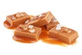 Salted toffee candies with caramel sauce isolated on white background. Golden Butterscotch toffee caramels