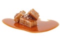 Salted toffee candies with caramel sauce isolated on white background. Salted caramel pieces. Golden Butterscotch toffee