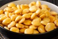 Salted yellow lupine beans close-up in a bowl. horizontal