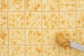 Saltine crackers background with knife full of peanut butter