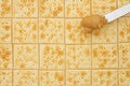 Saltine crackers background with knife full of peanut butter