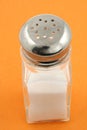 Saltshaker on orange background