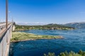 World\'s strongest maelstrom under Saltstraumen Bridge, picturesque village afar