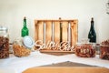 Salty bar of several kinds snacks decorated on wooden table. Closeup of lettering: `Salty Bar`. Wedding or party concept