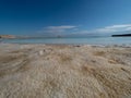 Salty beach at Ein Bokek Dead Sea Resort, Israel Royalty Free Stock Photo