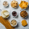 Salty beer snacks in whit bowls Royalty Free Stock Photo