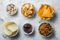 Salty beer snacks in whit bowls Royalty Free Stock Photo