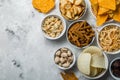 Salty beer snacks in whit bowls Royalty Free Stock Photo