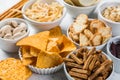 Salty beer snacks in whit bowls Royalty Free Stock Photo