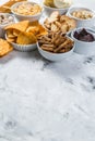 Salty beer snacks in whit bowls Royalty Free Stock Photo