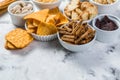 Salty beer snacks in whit bowls Royalty Free Stock Photo