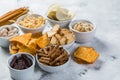 Salty beer snacks in whit bowls Royalty Free Stock Photo