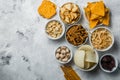 Salty beer snacks in whit bowls Royalty Free Stock Photo