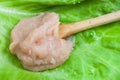 Salty caviar of codfish on wood spoon at leaf