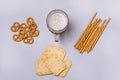 Salty Crackers Sticks Pretzels Top View Above Blue Background Party Snacks Mix Variety of Tasty Crackers for Beer Flat Lay Glass Royalty Free Stock Photo