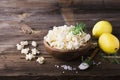 Salty crunchy fresh homemade popcorn flavored with lemon peel and rosemary scent in a wooden bowl on simple background Royalty Free Stock Photo