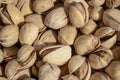 Salty delicious open pistachios in a bowl. brown natural background from natural nuts Royalty Free Stock Photo