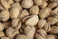 Salty delicious open pistachios in a bowl. brown natural background from natural nuts Royalty Free Stock Photo