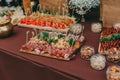 Salty nuts on wooden desk on table, wedding reception. beer bar and snacks. catering in restaurant