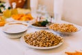 Salty peanuts and pistachios on the luxury served catering table Royalty Free Stock Photo
