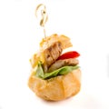 Salty profiterole appetizer with fish on white