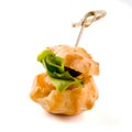 Salty profiterole appetizer with salad leave