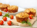 Salty snack cakes muffins with cheese, tomatoes and basil