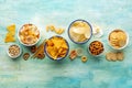 Salty snacks, overhead flat lay background with copy space. Party food Royalty Free Stock Photo