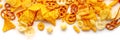 Salty snacks panorama. Party food on white. Potato and tortilla chips etc Royalty Free Stock Photo