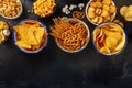 Salty snacks, party mix, overhead flat lay shot with copy space. An assortment