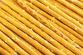 Salty sticks line in row background. Top view. Snack texture background. Salty bread sticks for beer background pattern Royalty Free Stock Photo