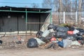 Saltykovka, Moscow Region, Russia - April 16 2019: Piles of garbage in plastic bin trash, waste bags. Landfill