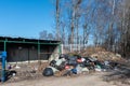 Saltykovka, Moscow Region, Russia - April 16 2019: Piles of garbage in plastic bin trash, waste bags. Landfill