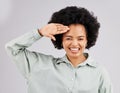 Salute, smile and portrait of black woman greeting feeling proud and excited making hand gesture isolated in a white