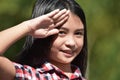 Saluting Cute Minority Girl Child