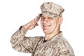 Saluting and smiling army soldier studio shoot Royalty Free Stock Photo