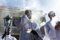 Catholic seminarians prepare with incense for the Palm Sunday procession