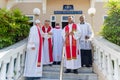 Catholic church priests are seen on a staircase during an open-air Mass on Palm Sunday Royalty Free Stock Photo