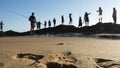 Fishermen with their fishing rods on the rocks in search of fish