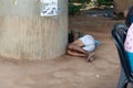 Salvador, Bahia, Brazil - August 11, 2023: Homeless man seen lying on the ground sleeping under an overpass