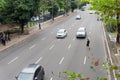 Salvador, Bahia, Brazil - August 11, 2023: Pedestrian is seen risking his life crossing the busy lanes of Avenida Tancredo Neves